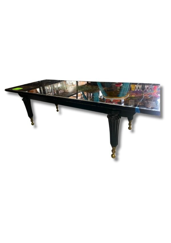 Mesa de centro de vidrio con base de madera y acabado de resina epoxi de color ámbar y negro ,largo 142cm ,de ancho 56cm y de alto 42cm